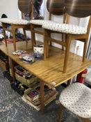 A MID CENTURY RETRO DINING TABLE AND FOUR CHAIRS.