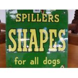 A GREEN GROUND ENAMEL SIGN FOR SPILLERS SHAPES. 30.5 x 30.5cms.