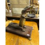 A TAXIDERMY ANTHROPOMORPHIC CAIMAN ON STAND.