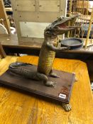 A TAXIDERMY ANTHROPOMORPHIC CAIMAN ON STAND.