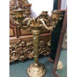 A GOLD DECORATED CAST IRON CANDELABRA OF LARGE PROPORTIONS.
