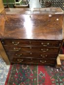 A LATE GEORGIAN MAHOGANY BUREAU WITH FITTED INTERIOR ON BRACKET FEET. W 92 X D 52 X H 103cms.