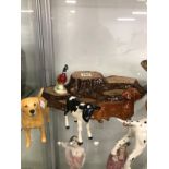 A COLLECTION OF BESWICK AND OTHER DOGS, A STAND AND A LEAPING FISH