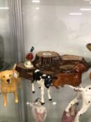 A COLLECTION OF BESWICK AND OTHER DOGS, A STAND AND A LEAPING FISH