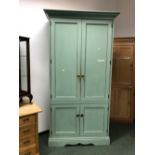 A TALL PAINTED PINE FOUR DOOR CABINET. W 119 X D 50 X H 225cms.