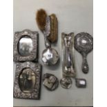 TWO HALMARKED SILVER PHOTO FRAMES, VARIOUS SILVER DRESSING TABLE ITEMS, BUTTIN HOOKS ETC.