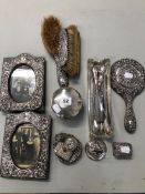 TWO HALMARKED SILVER PHOTO FRAMES, VARIOUS SILVER DRESSING TABLE ITEMS, BUTTIN HOOKS ETC.
