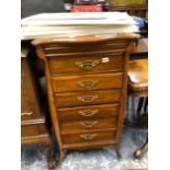 AN EDWARDIAN OAK MUSIC CABINET. W 53 X D 45 X H 103cms.