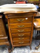 AN EDWARDIAN OAK MUSIC CABINET. W 53 X D 45 X H 103cms.