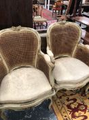 A PAIR OF ANTIQUE FRENCH BERGERE ARMCHAIRS.