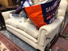 AN EDWARDIAN BUTTON BACK DROP END TW SEAT SETTEE.