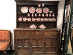 A GEORGIAN OAK COUNTRY DRESSER AND PLATE RACK.