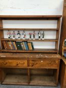 AN ANTIQUE PINE DRESSER BASE AND LATER RACK ABOVE.