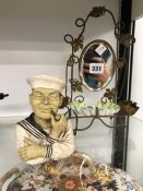 A BRASS TWO LIGHT GIRANDOLE WITH PORCELAIN DISH TRAY TOGETHER WITH A COMPOSITION BUST OF A SAILOR