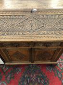 AN ANTIQUE CARVED OAK BUREAU. W 91 X D 52 X H 98cms.