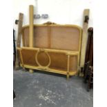 AN ANTIQUE GILDED AND CANED FRENCH DOUBLE BED. W 158 X 135cms.