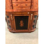 A VICTORIAN WALNUT AND INLAID CREDENZA WITH BOW GLASS END CABINETS.