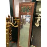 AN ARTS AND CRAFTS STYLE MIRROR.