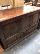 AN 18th C. OAK PANEL FRONT TWO DRAWER MULE CHEST. W 123 X D 52 X H 80cms.