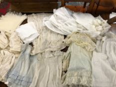 A QUANTITY OF MAINLY ANTIQUE AND LATER CHRISTENING GOWNS,SHAWL, DRESSES, BIBS IN SILK, LACE AND