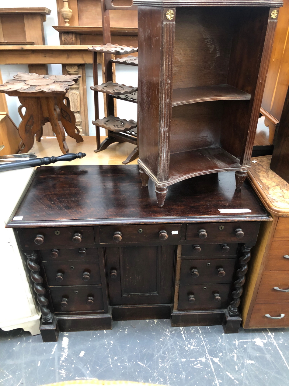 AN ANTIQUE OAK KNEE HOLE WRITING DESK WITH NINE DRAWERS FLANKING A CUPBOARD. TOGETHER WITH A PAINTED