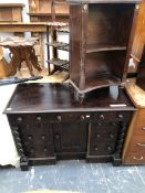 AN ANTIQUE OAK KNEE HOLE WRITING DESK WITH NINE DRAWERS FLANKING A CUPBOARD. TOGETHER WITH A PAINTED