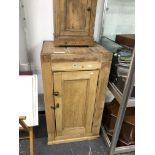 A VICTORIAN PINE PANEL DOOR CABINET AND A BEDSIDE CABINET.