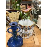 A MAJOLICA JUG, TWO OTHER JUGS, A QUIMPER TWO HANDLED PLANTER AND A TORQUAY WARE CANDLESTICK