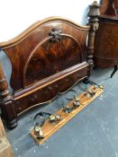 A GROUP OF SIX ANTIQUE SERVANTS BELLS, TOGETHER WITH A FLAME MAHOGANY HEADBOARD.