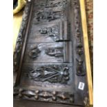 AN ANTIQUE CARVED PINE PANEL.