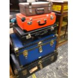 VARIOUS CABIN TRUNKS AND SUITCASES.