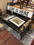 A LOVE IS HERE BENCH WITH FOLDING LEGS FOR STORAGE.