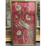 AN EASTERN METAL THREAD EMBROIDERED PANEL IN GLAZED FRAME.