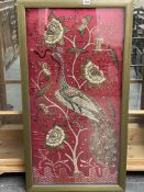 AN EASTERN METAL THREAD EMBROIDERED PANEL IN GLAZED FRAME.