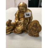 A GILT BRONZE FIGURE OF A SEATED BUDDHA WITH TOAD AND A FURTHER GILDED DEITY.