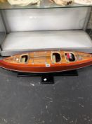 A SCALE MODEL SPEED BOAT ON A BESPOKE STAND AND FLYING THE ITALIAN NAVAL COLOURS