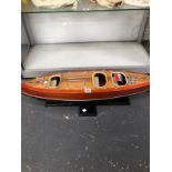 A SCALE MODEL SPEED BOAT ON A BESPOKE STAND AND FLYING THE ITALIAN NAVAL COLOURS