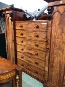 A LARGE WILLIAM IV FLAME MAHOGANY COMPACTUM WARDROBE WITH SIX CENTRAL DRAWERS. W 244 X D 67 X