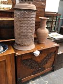 AN ANTIQUE CARVED OAK FALL FRONT FOLIO CABINET, TOGETHER WITH A STEEL PIERCED LANTERN AND A VASE.