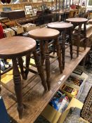 A TALL OAK SIDE TABLE AND FOUR ANTIQUE STOOLS. W 167 X D 53 X H 76cms.