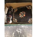 A MIDDLE EUROPEAN BLACK GROUND BAG EMBROIDERED WITH FLOWERS AND A PAIR OF SHOES EN SUITE