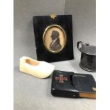AN 1834 SILHOUETTE MINIATURE, A MINIATIRE LEATHER BOUND AND CASED PRAYER BOOK, AN ANTIQUE IVORY SHOE