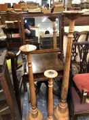 THREE WOODEN PRICKET CANDLESTICKS AND A SWING MIRROR.