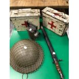 TWO RED CROSS METAL BOXES, A TORCH, A WWII HELMET AND A BAYONET