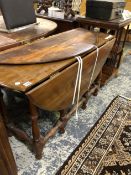 AN INTERESTING BERMUDA CEDAR WOOD GATE LEG TABLE. W 120 X D 125 X H 69cms.