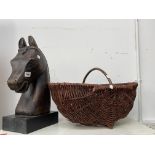 A CARVED HORSES HEAD FIGURE AND A FLOWER BASKET.