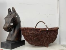 A CARVED HORSES HEAD FIGURE AND A FLOWER BASKET.