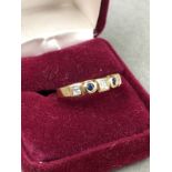 A HALLMARKED 9ct GOLD GOLD CUBIC ZIRCONIA HALF ETERNITY RING. FINGER SIZE M. WEIGHT 4.7grms.