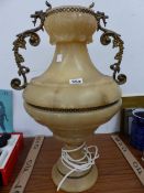 A GILT METAL HANDLED ALABASTER BALUSTER VASE AS TABLE LAMP LIT FROM THE INSIDE. H 56cms.
