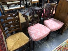 A PAIR OF ANTIQUE SHIELD BACK CHAIRS AND A LADDER BACK EXAMPLE.